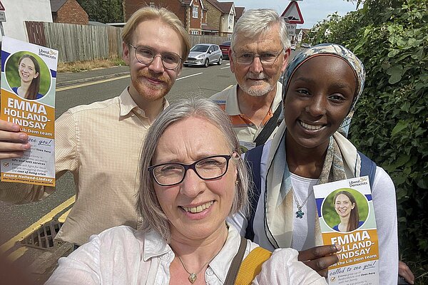 Jenny WIlkinson seen with 3 others in a street holding Mid-Beds leaflets